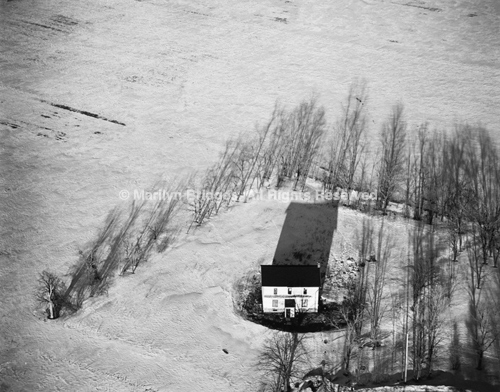 Lone White House in Snow, Scottsville, New York, 1982. USA Northeast. copyright photographer Marilyn Bridges.